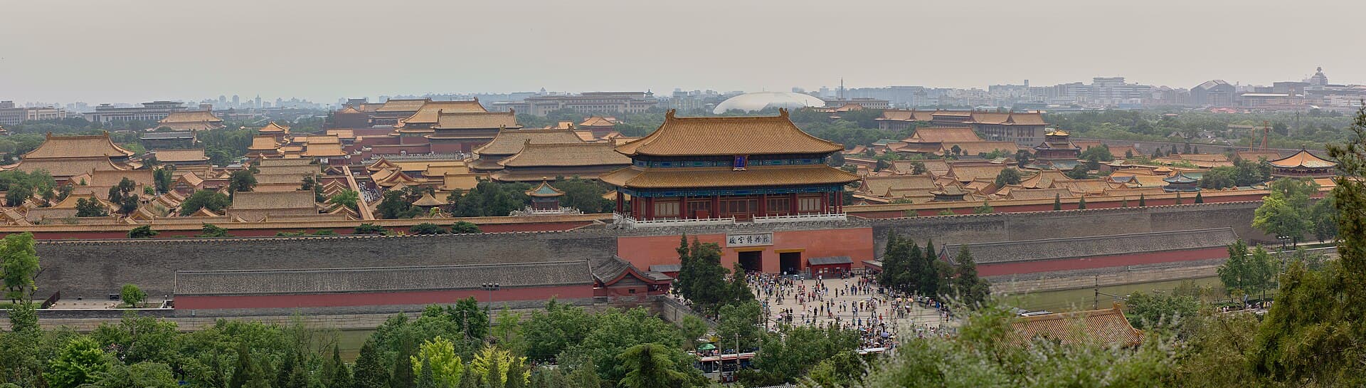 The golden roofs of the Forbidden City seen from the top of Jingshan hill, stretching south under a hazy sky