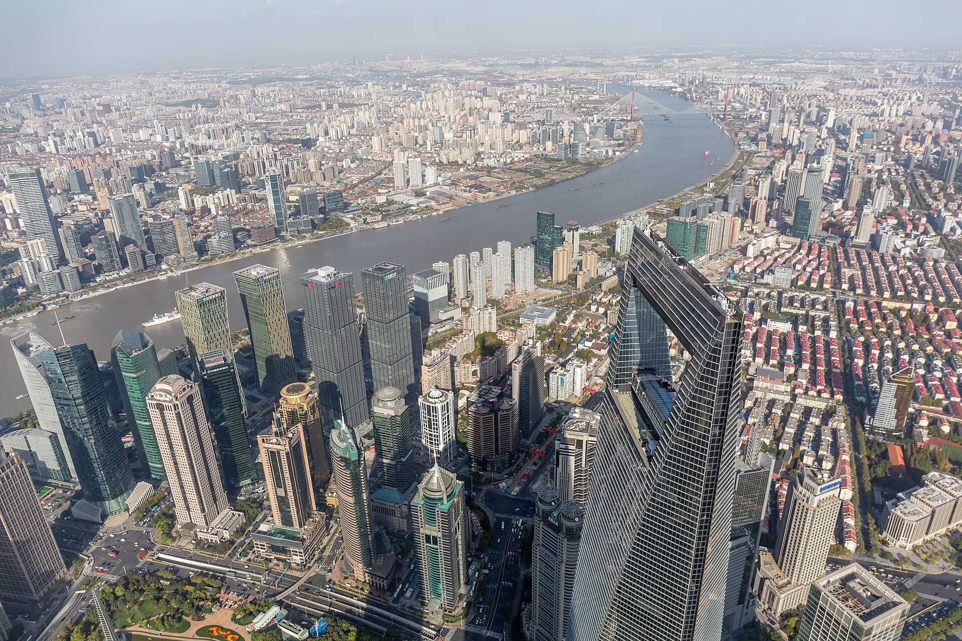 Looking down from the Shanghai Tower over Lujiazui's skyscrapers and the bend of the Huangpu River